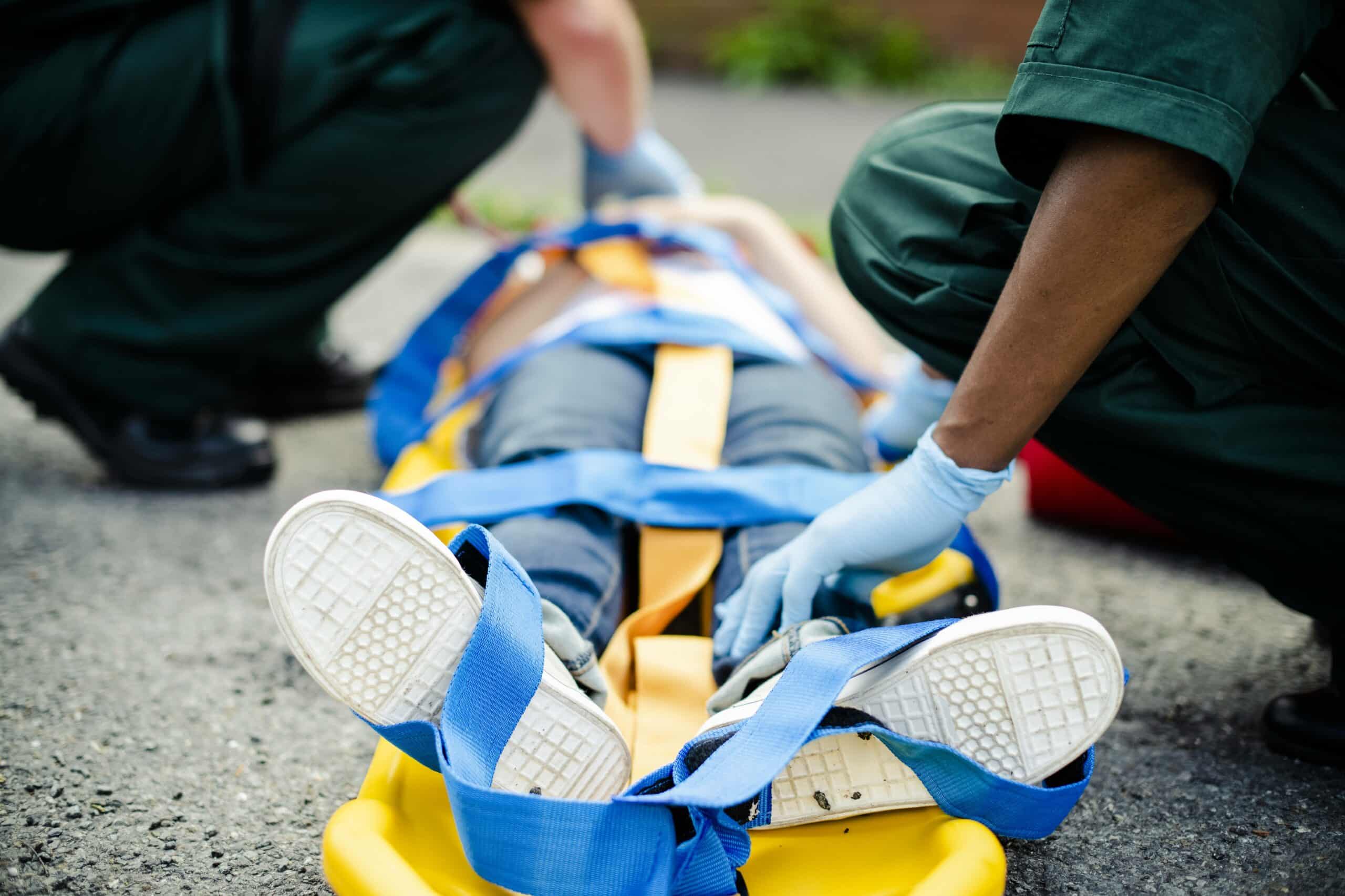 Paramedic team rescuing a young critical patient